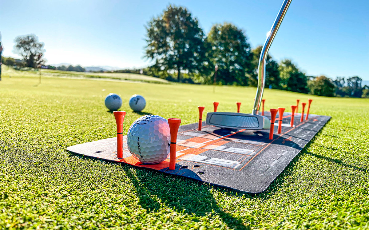 Wellstroke training outside on a putting green